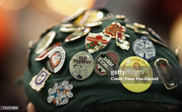 Man wears a baseball cap covered in badges at the Great British Beer Festival on August 1, 2006 in London. The Great British Beer Festival runs from...