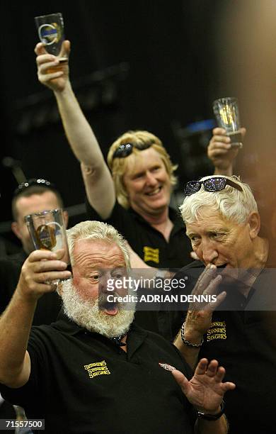 London, United Kingdom: A group of drinkers representing Skinners Brewery sing a toast during the opening day of The Great British Beer Festival in...