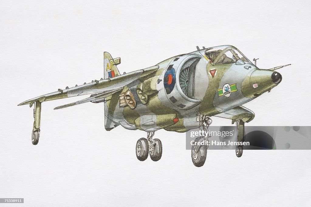 Flying Harrier Jet with wheels out ready for landing.