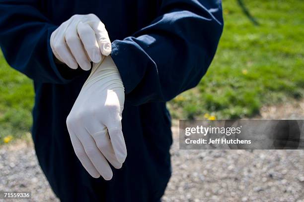 Farm workers suit up to protect the over 600,000 chickens which pass through the growout house every year of the Shenendoah Valley farm, owned by the...