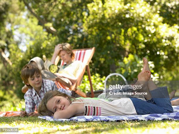family relaxing - shade stock pictures, royalty-free photos & images