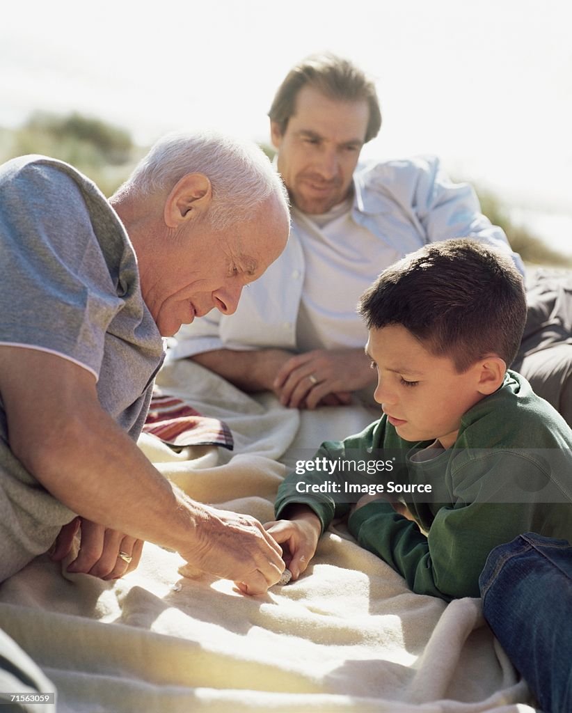 Family looking at shells