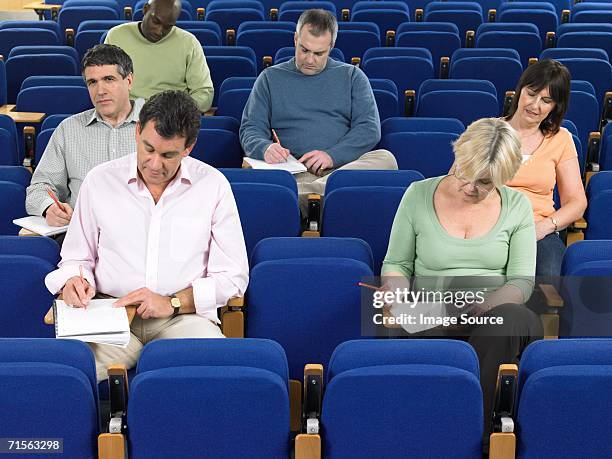 mature students in a lecture - avondschool stockfoto's en -beelden