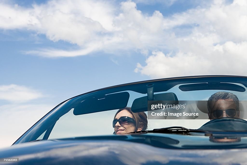 Couple in a convertible