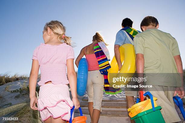 family leaving the beach - end of summer stock pictures, royalty-free photos & images