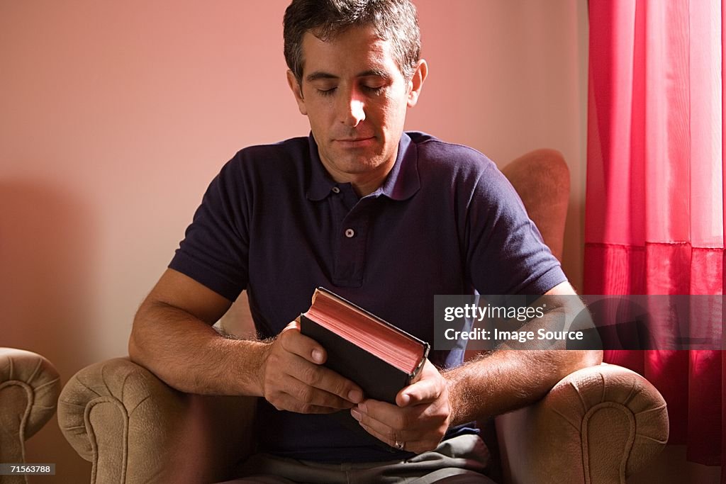 Man holding the bible