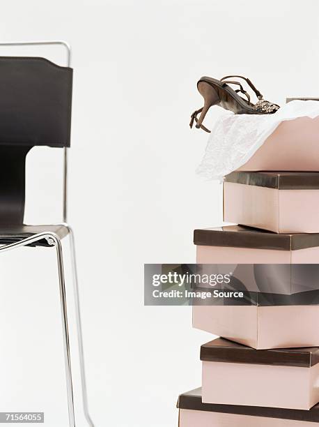 chair and shoeboxes - shoe box stock pictures, royalty-free photos & images