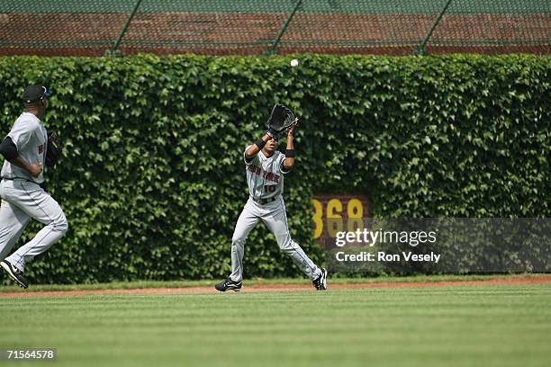 Endy Chavez of the New York Mets plays a fly ball during the game against the Chicago Cubs at Wrigley Field in Chicago, Illinois on July 14, 2006....