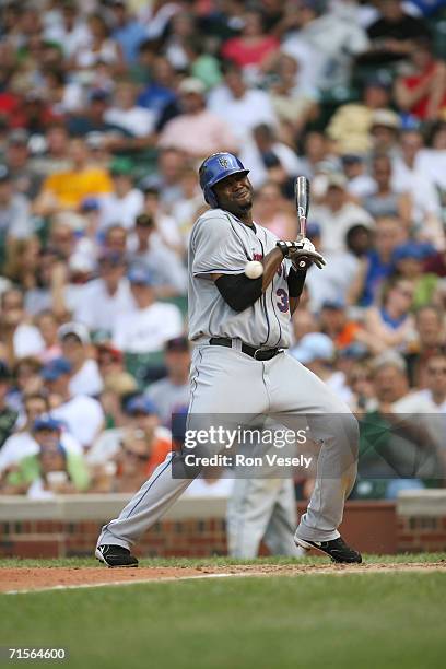 Cliff Floyd of the New York Mets gets hit by a pitch during the game against the Chicago Cubs at Wrigley Field in Chicago, Illinois on July 14, 2006....