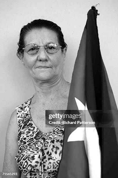 Cuban-born Gladys Garcia is left Cuba in 1980 on the Mariel boatlift, poses for a photo as she celebrates with other Cubans on the famous Calle Ocho...