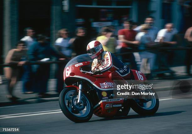 English racing motorcyclist John Williams riding a works Honda down Bray Hill in the Formula One event at the Isle of Man TT races, June 1978....