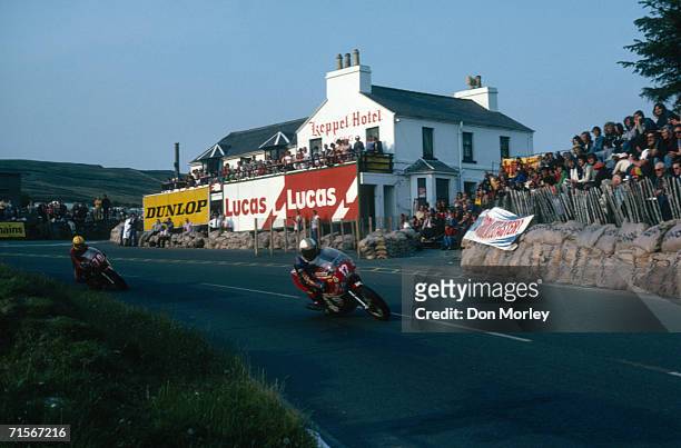 British racing motorcyclist Mike Hailwood leading Joey Dunlop down Mountain Road in the Formula One race at the Isle of Man TT races, June 1978....
