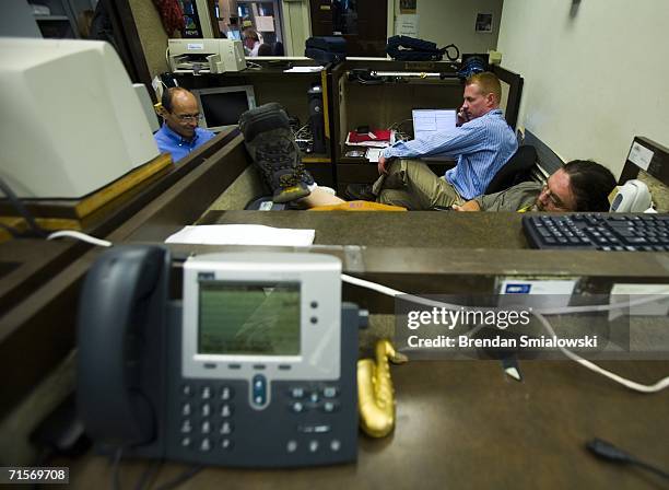 Journalists work at computer stations in the White House August 2, 2006 in Washington, DC. White House press corps will leave their facilities for...