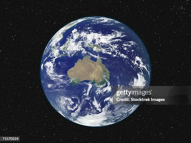 fully lighted image of earth centered on australia and oceania. - australia from space stock-fotos und bilder