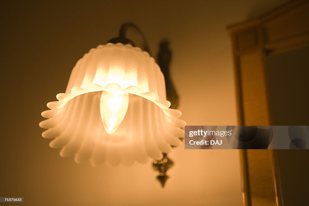 Close-up of lamp in hotel room, low angle view
