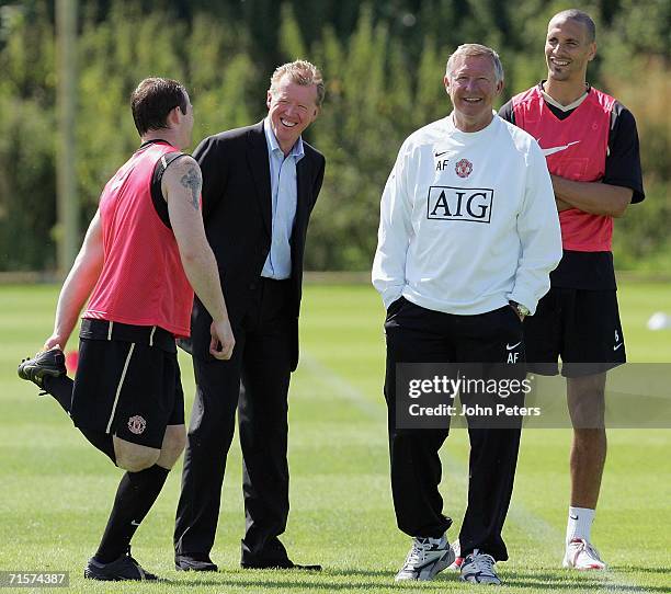 Sir Alex Ferguson of Manchester United and England manager Steve McClaren share a joke with Wayner Rooney and Rio Ferdinand during a first team...