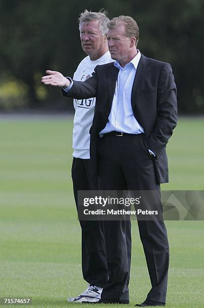 Sir Alex Ferguson of Manchester United and England manager Steve McClaren watch from the sidelines during a first team training session at Carrington...