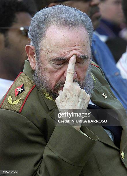 Cuban President Fidel Castro gestures during the inauguration of the II Cuban Sport Olympic games 18 April, 2004 in Havana. Speculation grew over...