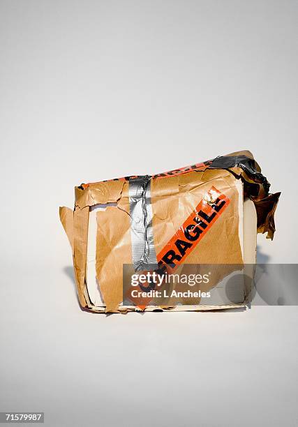 a broken parcel. - damaged parcel stock pictures, royalty-free photos & images