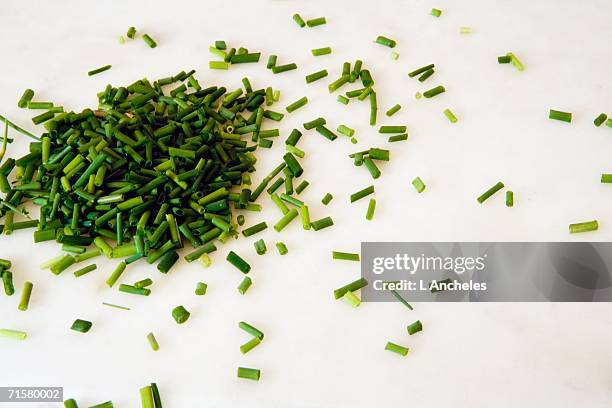 chopped chives on a white background. - chive stock pictures, royalty-free photos & images