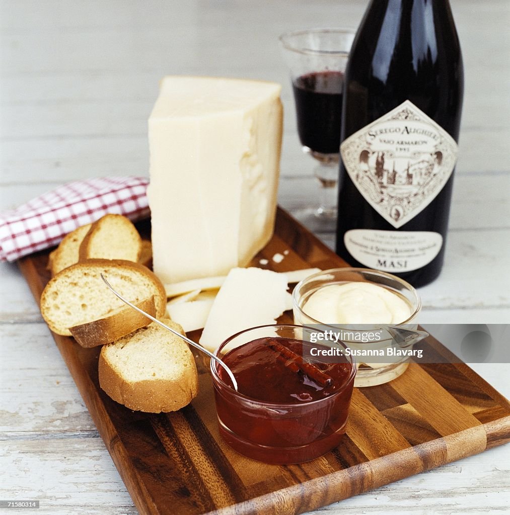 Bread cheese marmalade and wine.