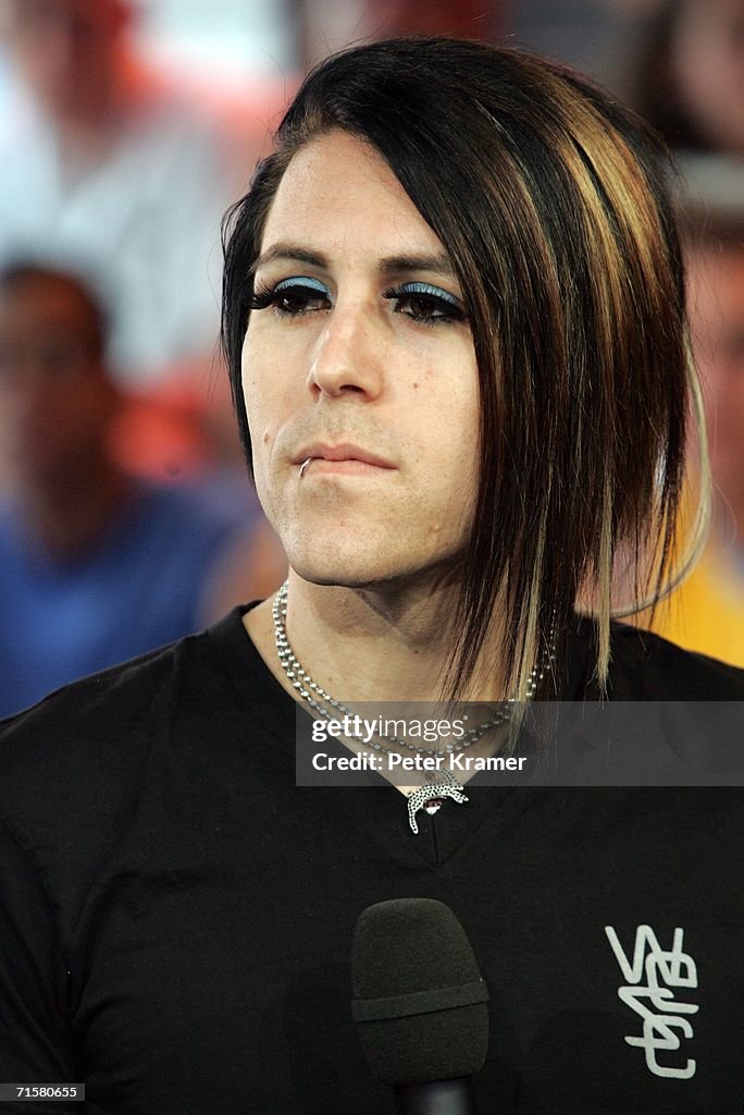 Lead singer Davey Havok of the band AFI stands on stage during a