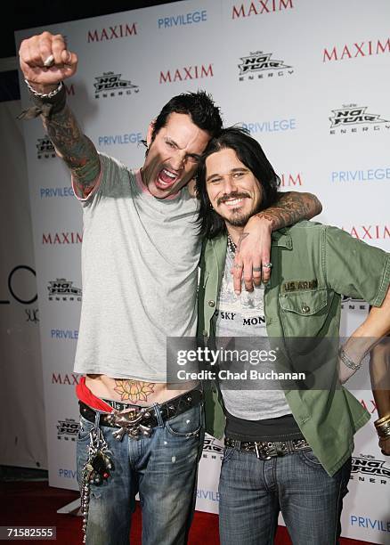 Tommy Lee and Gilby Clarke attend the "Celebrate Extreme Sports With Maxim Magazine" Party on August 3, 2006 in Los Angeles, California.