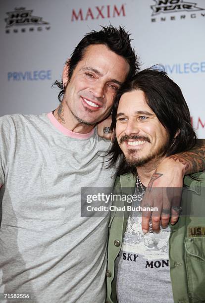 Tommy Lee and Gilby Clarke attend the "Celebrate Extreme Sports With Maxim Magazine" Party on August 3, 2006 in Hollywood, California.