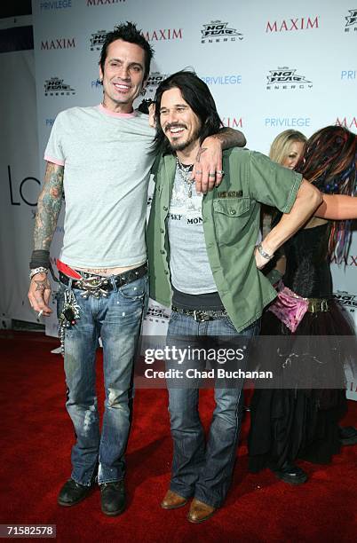 Tommy Lee and Gilby Clarke attend the "Celebrate Extreme Sports With Maxim Magazine" Party on August 3, 2006 in Hollywood, California.