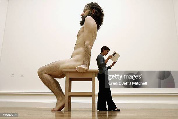 Visitor to the National Galleries of Scotland view the work of Australian born, London based sculptor Ron Mueck on August 4,2006 Edinburgh in...