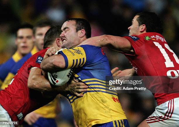 Mark Riddell of the Eels is taken high during the round 22 NRL match between the Parramatta Eels and the St George Illawarra Dragons at Parramatta...