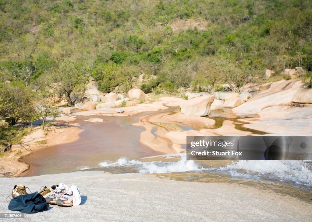 Shoes at the top of a Waterfall