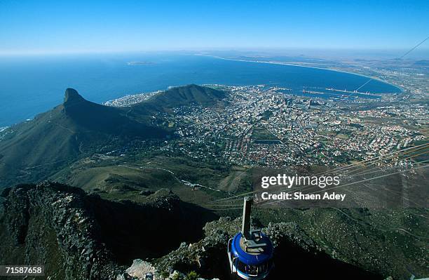cable car to table mountain - city and signal hill below - cape town cable car stock pictures, royalty-free photos & images