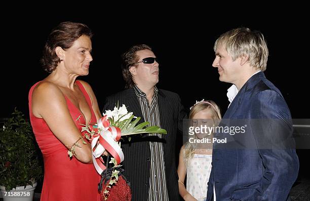 Princess Stephanie of Monaco, musicians Andy Taylor, with his daughter, and Nick Rhodes of Duran Duran attend a cocktail reception at the Monaco Red...