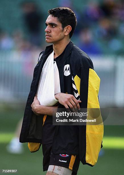 Jarrad Oakley-Nicholls for the Tigers leaves the ground injured during the round 18 AFL match between the Richmond Tigers and the Western Bulldogs at...