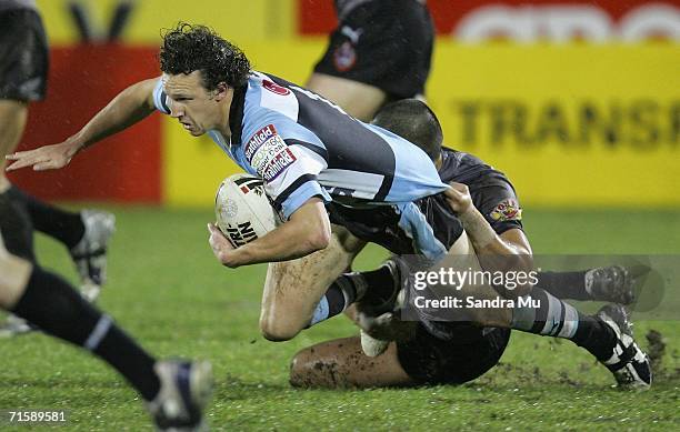 Brett Kearney of the Sharks slips during the round 22 NRL match between the Warriors and the Cronulla-Sutherland Sharks at Ericsson Stadium on August...