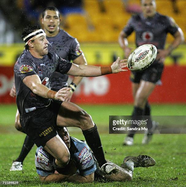 Nathan Fien of the Warriors off loads the ball during the round 22 NRL match between the Warriors and the Cronulla-Sutherland Sharks at Ericsson...