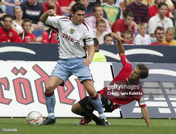 Barry Gareth of Aston Villa vies for the ball with Steven Cherundolo of Hanover during the friendly match between Hanover 96 and Aston Villa at AWD...