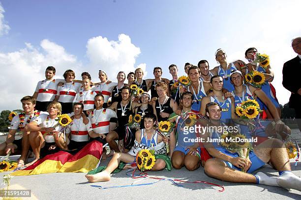The New Zealand, Italian and German junior mens eight pose for a group photograph during the World Rowing Junior Championships on the Bosbann Regatta...