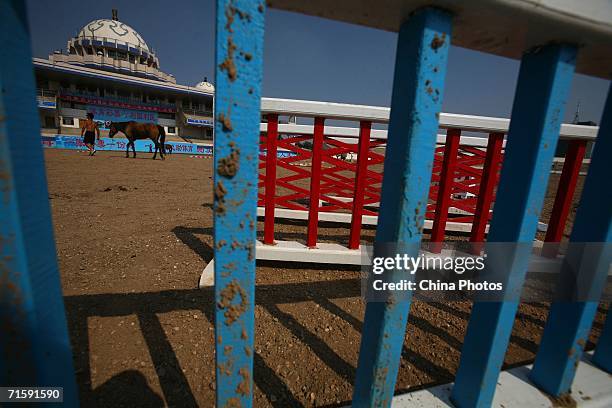 Rider walks his horse at the Inner Mongolia Racetrack on August 4, 2006 in Hohhot of Inner Mongolia Autonomous Region, China. The Inner Mongolia...