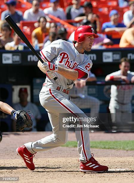 Chase Utley of the Philadelphia Phillies hits a pinch hit single in the ninth inning against the New York Mets on August 5, 2006 at Shea Stadium in...