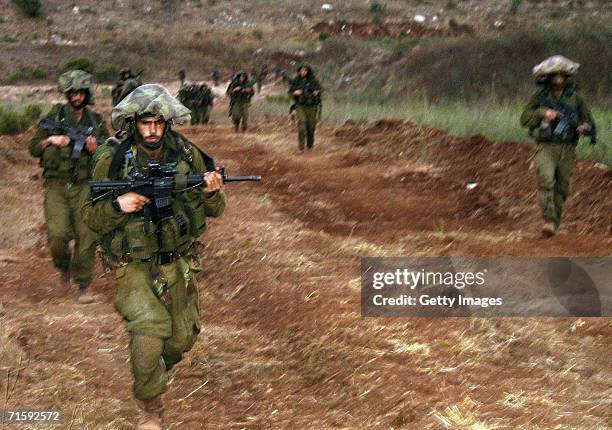 In this photo released by the Israel Defense Forces , Israeli infantry troops from the Nahal brigade operate against Hezbollah fighters August 5,...