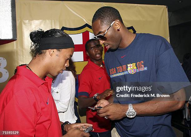 Ronaldinho of Brazil and Kobe Bryant of the Los Angeles Lakers speak at Nike European Club Champion FC Barcelona Rally at Hollywood and Highland on...