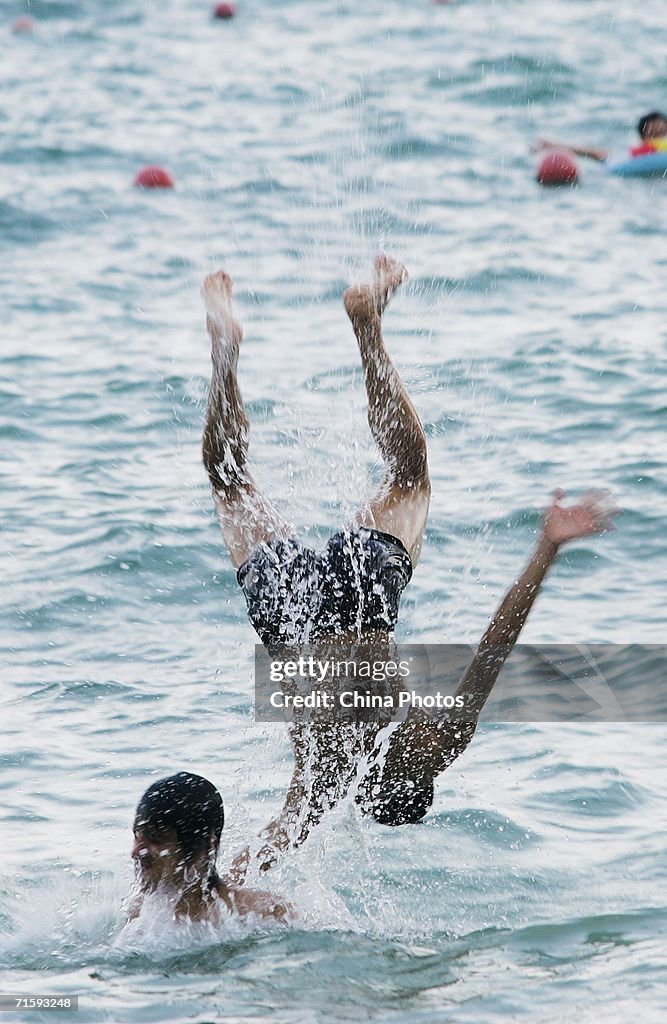 Shenzhen Bathing Beach Thronged With Swimmers