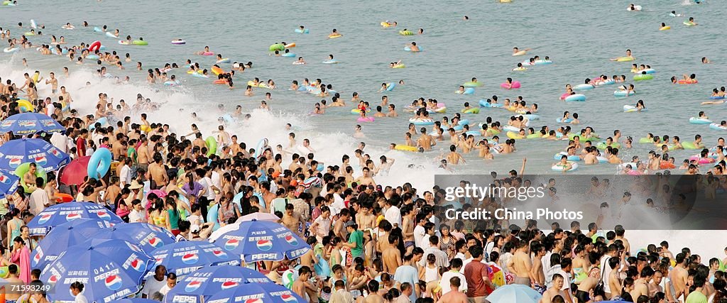 Shenzhen Bathing Beach Thronged With Swimmers