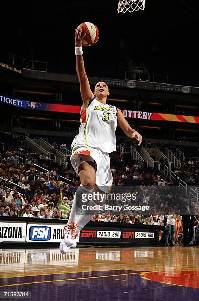 Diana Taurasi of the Phoenix Mercury shoots a layup against the Los Angeles Sparks in a WNBA game played on August 5 at U.S. Airways Center in...