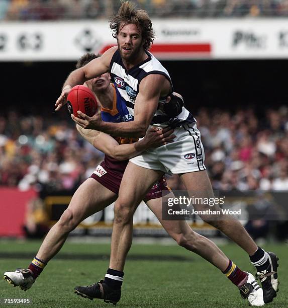 Joel Corey of Geelong looks to get a pass away during the round 18 AFL match between the Brisbane Lions and Geelong at the Gabba on August 6, 2006 in...