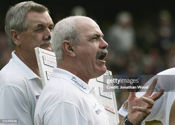 Leigh Matthews of the Lions speaks to his players during the round 18 AFL match between the Brisbane Lions and Geelong at the Gabba on August 6, 2006...