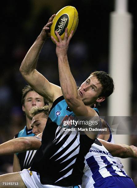 Michael Pettigrew of the Power marks during the round 18 AFL match between the Kangaroos and the Port Adelaide Power at the Telstra Dome on August 6,...