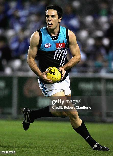 Troy Chaplin of the Power in action during the round 18 AFL match between the Kangaroos and the Port Adelaide Power at the Telstra Dome on August 6,...